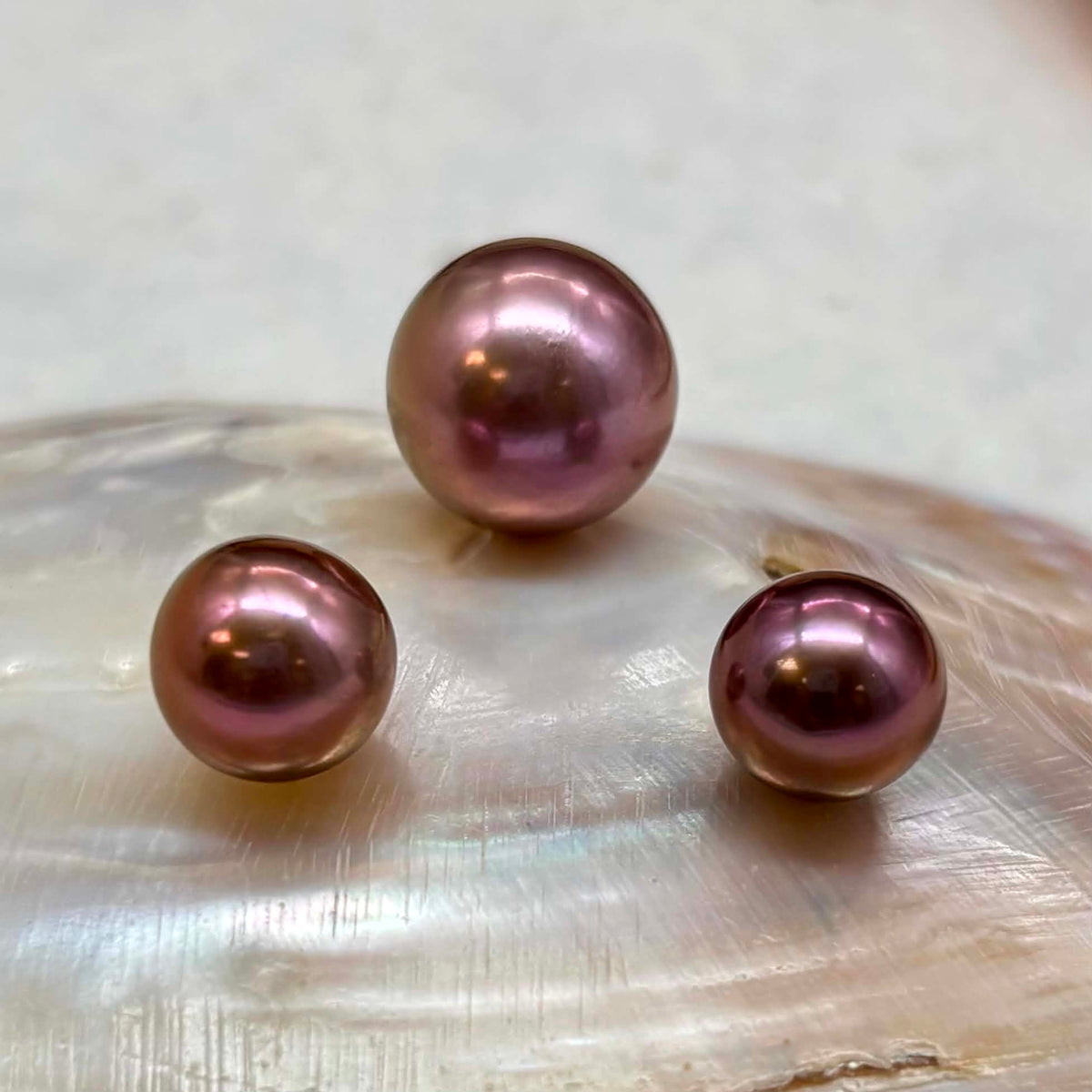 Rare Imperial Plum Pearl Trio — Mirror Luster